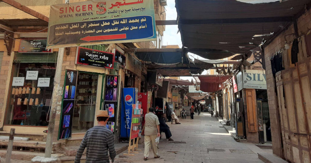 Shops and people in the market at Aswan